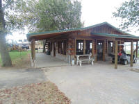 The pavilion is 24' x 40' log structure with plenty of tables 